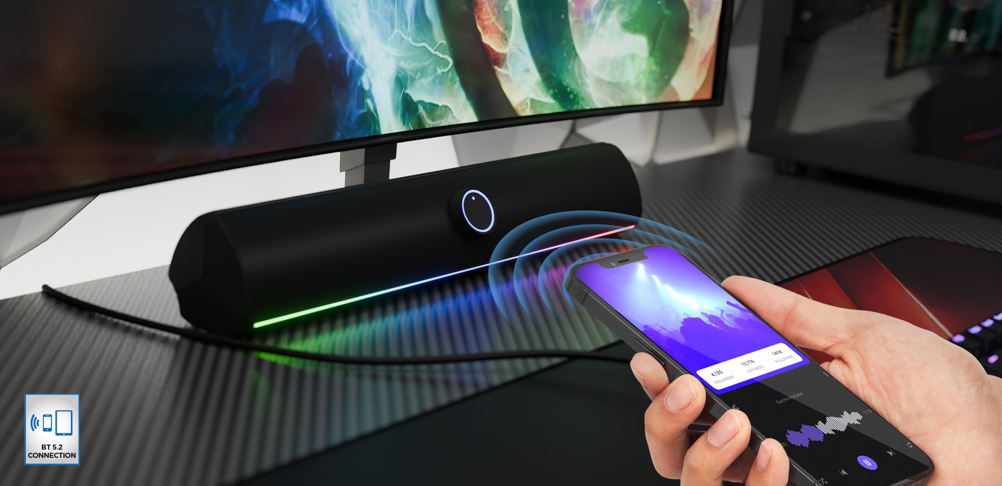 Bluetooth саундбар в черен цвят с LED осветление, управляван безжично от смартфон на бюрото